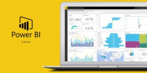 Image displaying a Power BI report being viewed on a laptop screen, showcasing data visualizations and analytics.